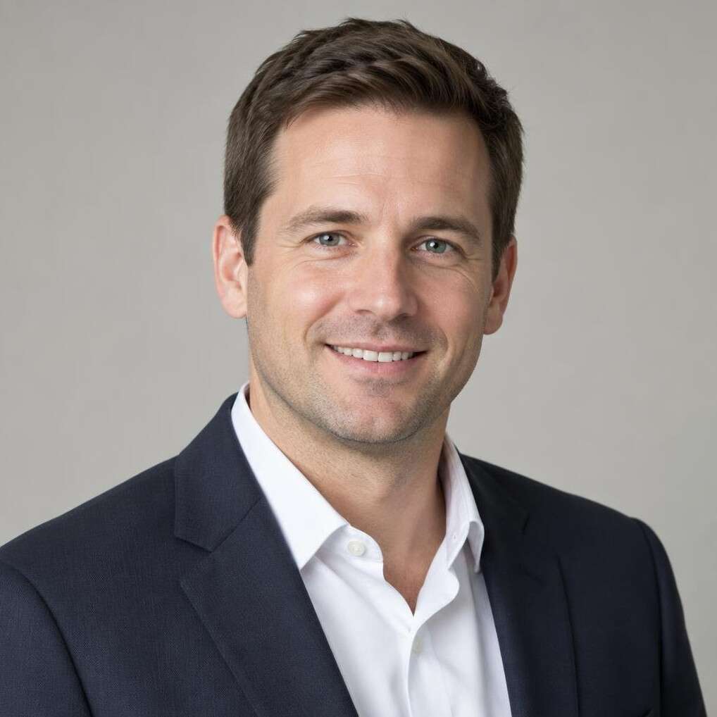 Portrait of a businessman in a suit with a neutral background
