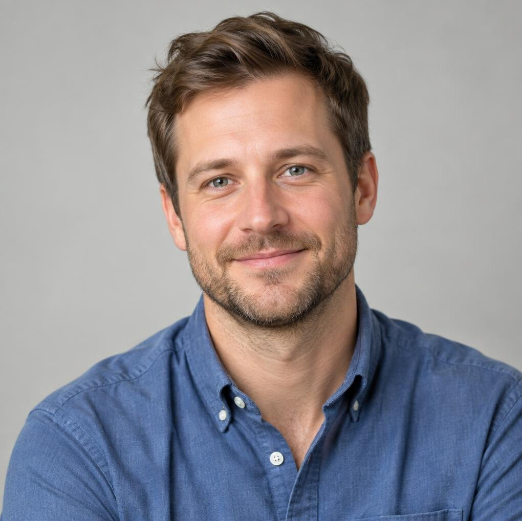 Portrait of a man with a light beard in a casual shirt