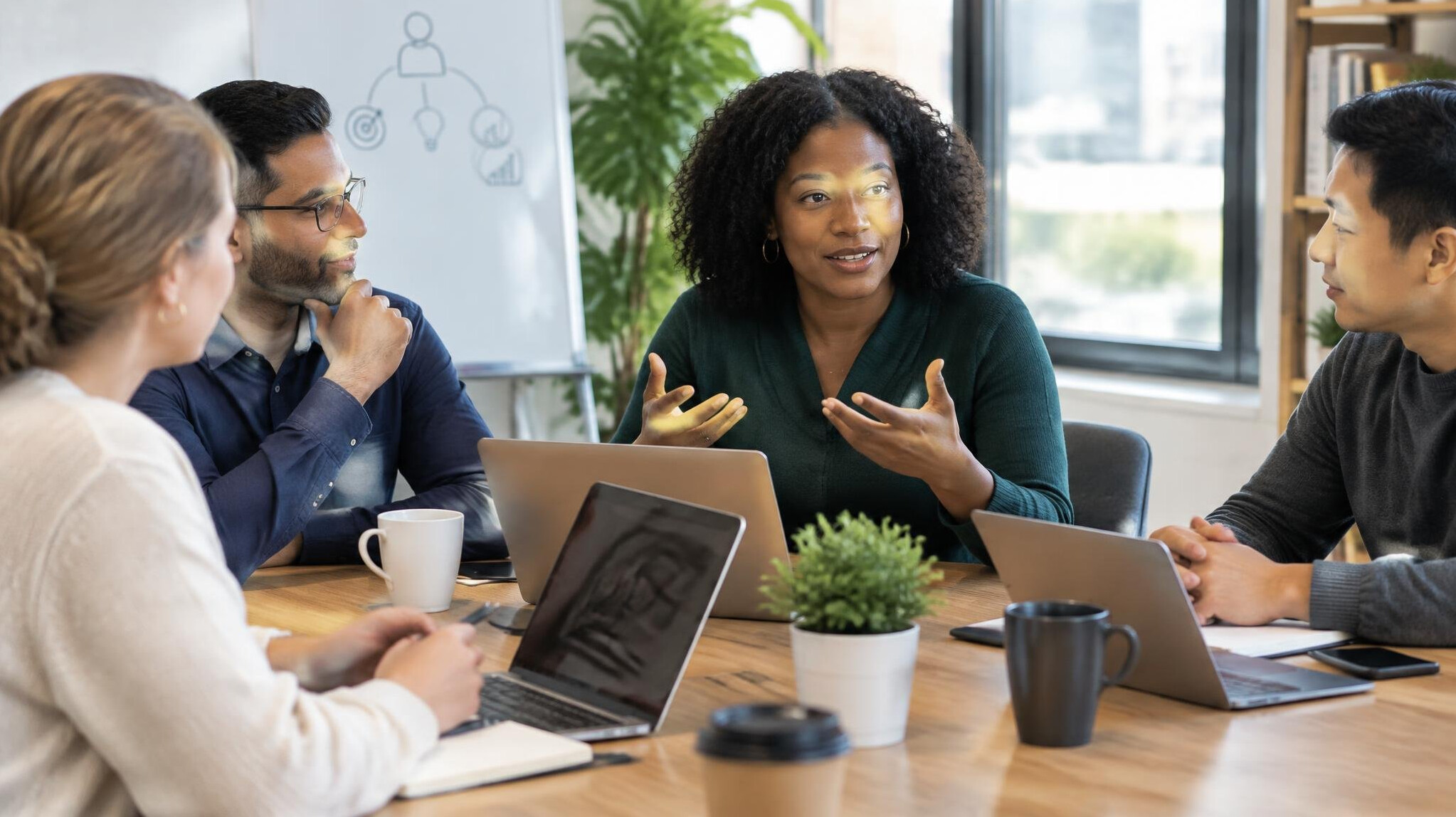 Colleagues in a discussion around a meeting table